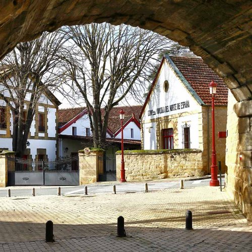 Cune winery in Haro, Rioja, visible through a stone archway