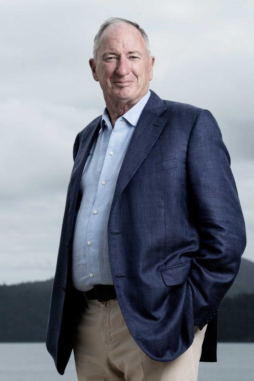 Sandy Oatley, Executive Chairman, outdoors portrait image, in smart navy jacket (image credit: Nic Walker)