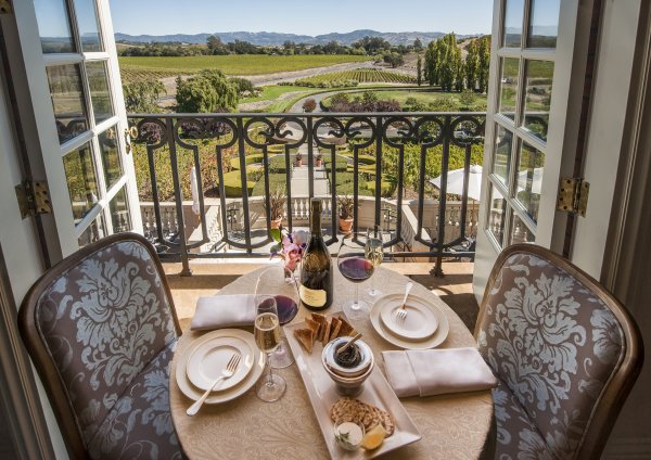 Table set at a balcony window overlooking the terrace at the winery