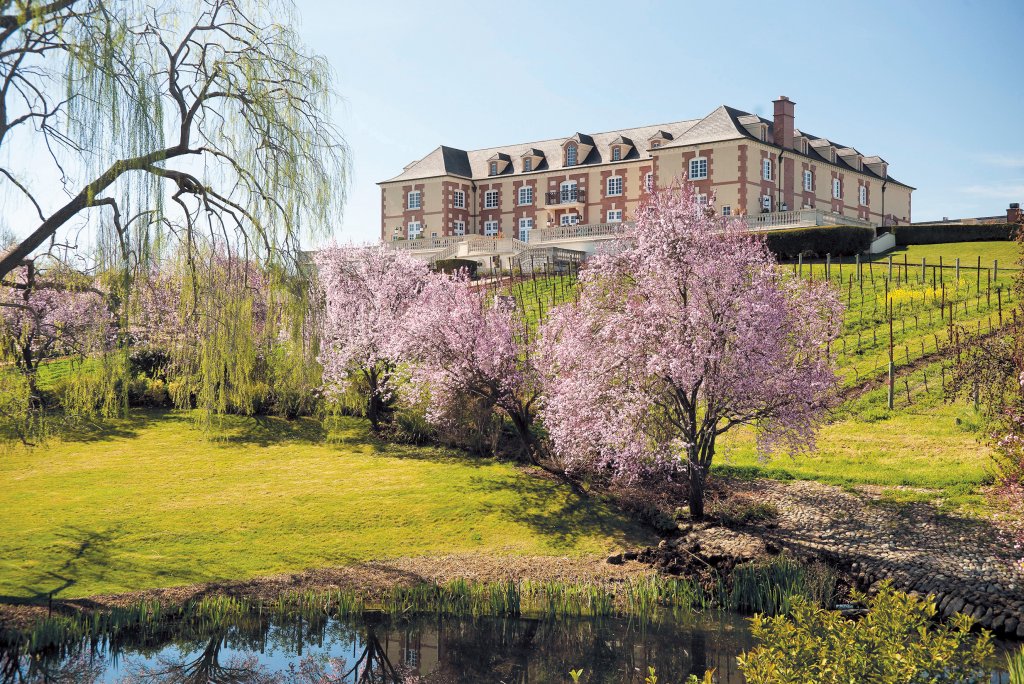 Winery viewed from the cherry blossom lined lake side. Image credit Avis Mandel Pictures