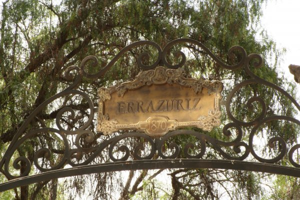 Metal gate Errazuriz name plate at entrance to original 1870 winery
