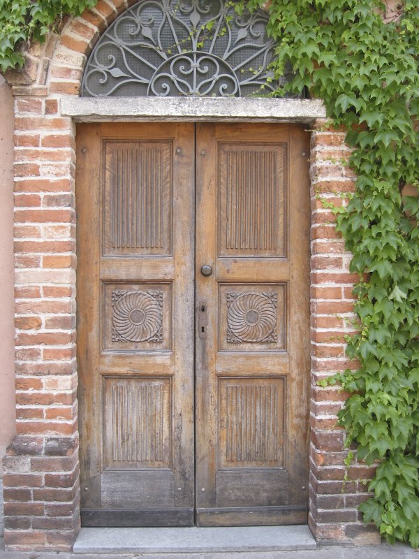 An old wooden door of the Gaja Barbaresco winery