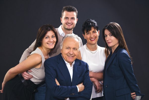 Gaja family portrait against a dark background, Angelo front centre, Gaia (left), Giovanni (top left), Lucia (top right), Rossana (right)