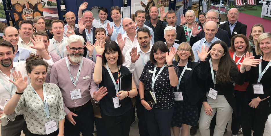 Hatch Mansfield team wave to camera at London Wine Fair 2019