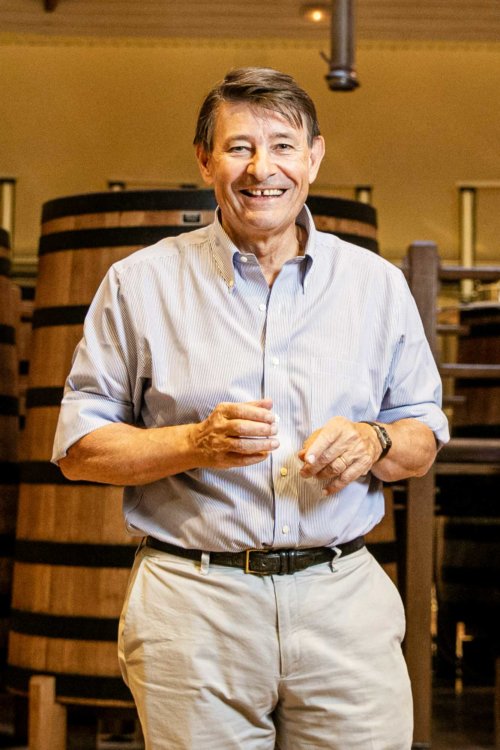 Pierre-Henry Gagey, Louis Jadot President, standing among the wooden fermenters in Beaune