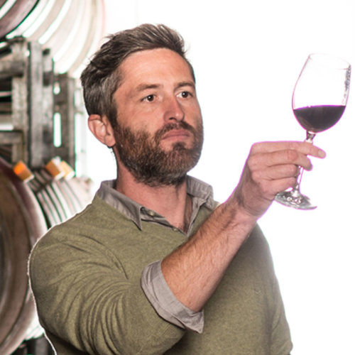 Dave Roper examining glass red wine